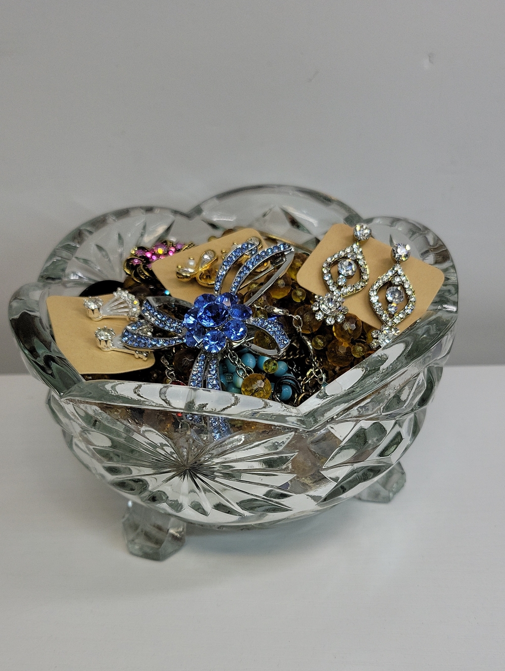 Assorted Jewelry In A Glass Dish